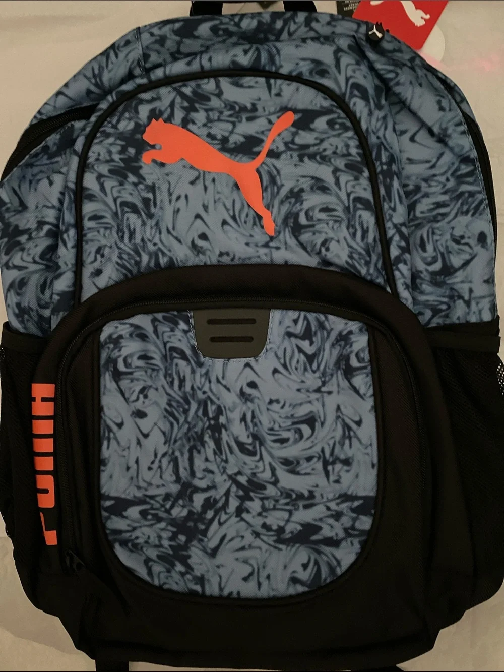 Puma Blue Marble Backpack with Orange Logo and Black Accents